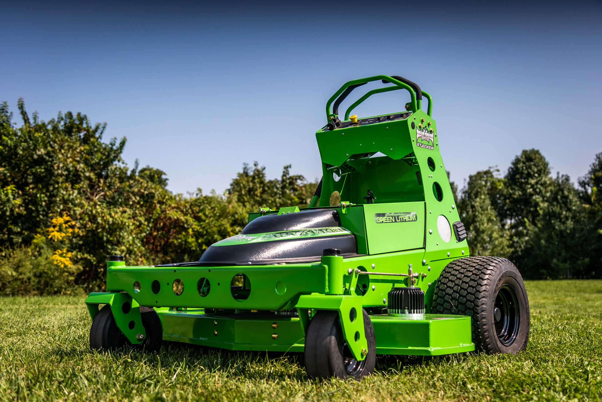 bright green electric mower in grass