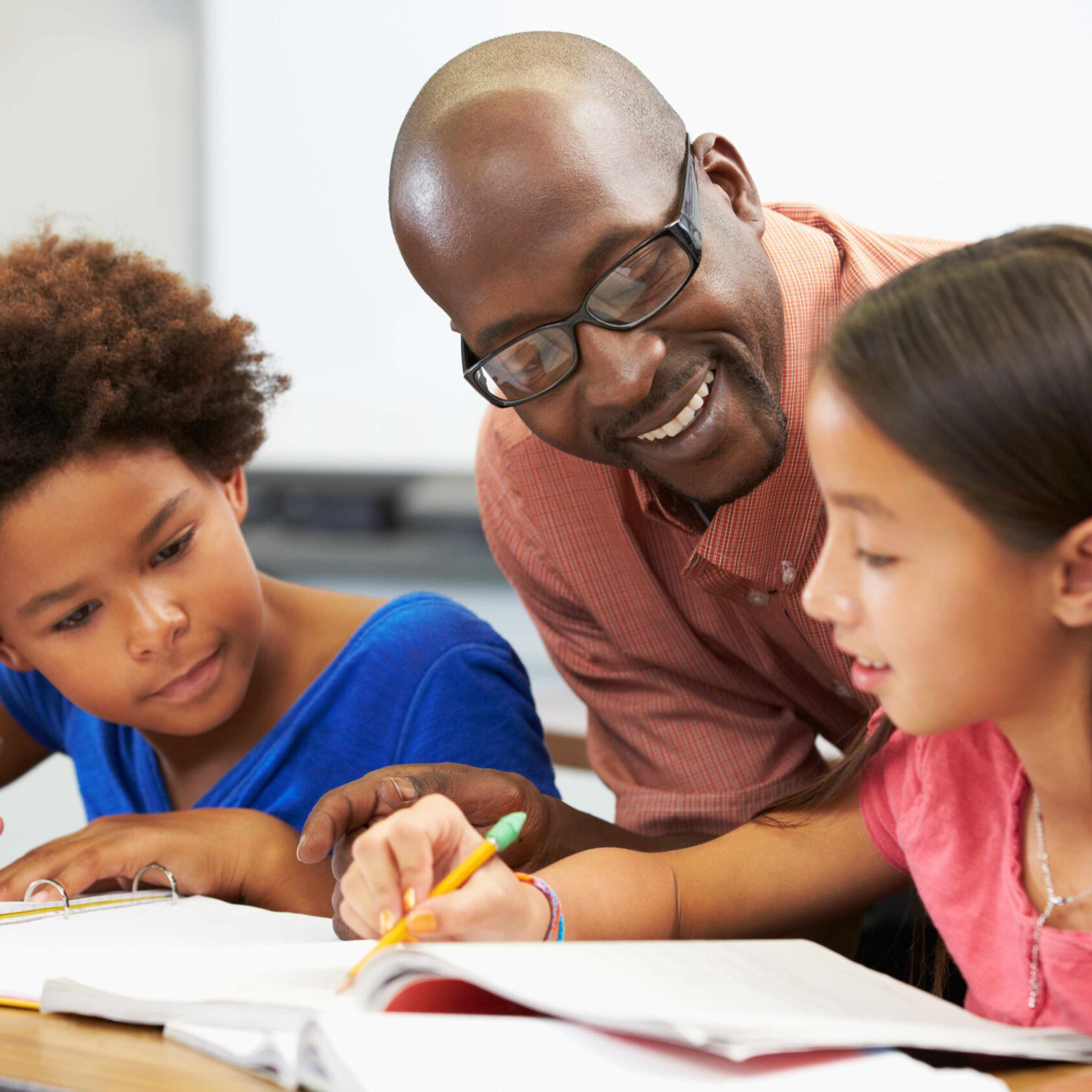 School classroom with students and teacher.
