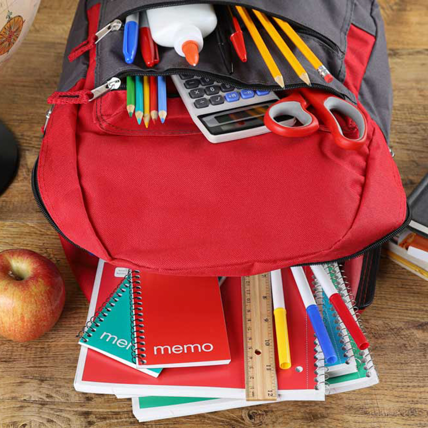 Assortment of School Supplies in a Book Bag